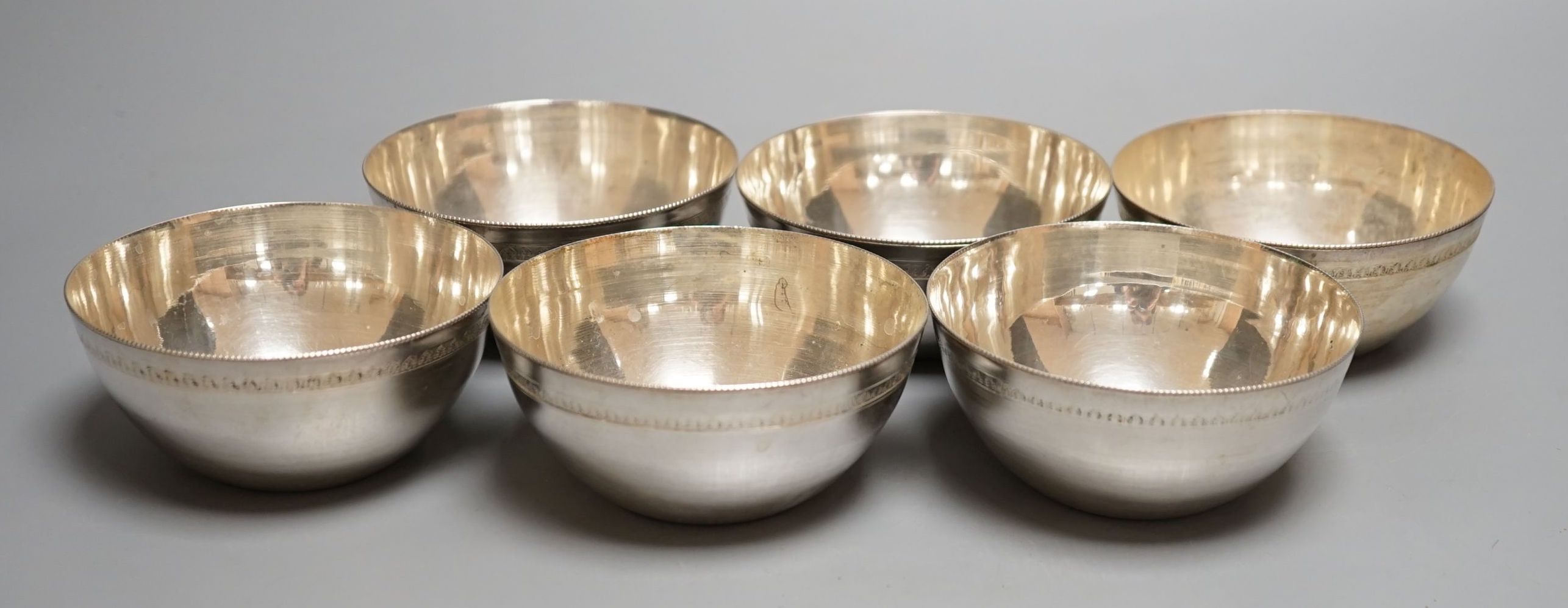 A set of six 20th century Egyptian white metal finger bowls, 10.3cm, 17.5oz.